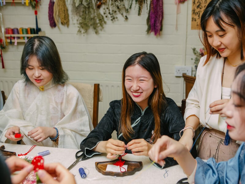 woman smiling at a creative workshop